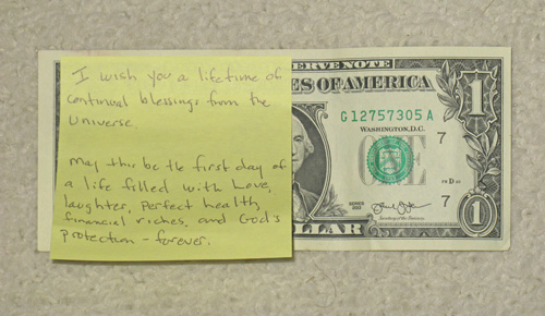 Just press the sticky note onto the dollar. A small step to increased wealth. Leave 1 Dollar.
